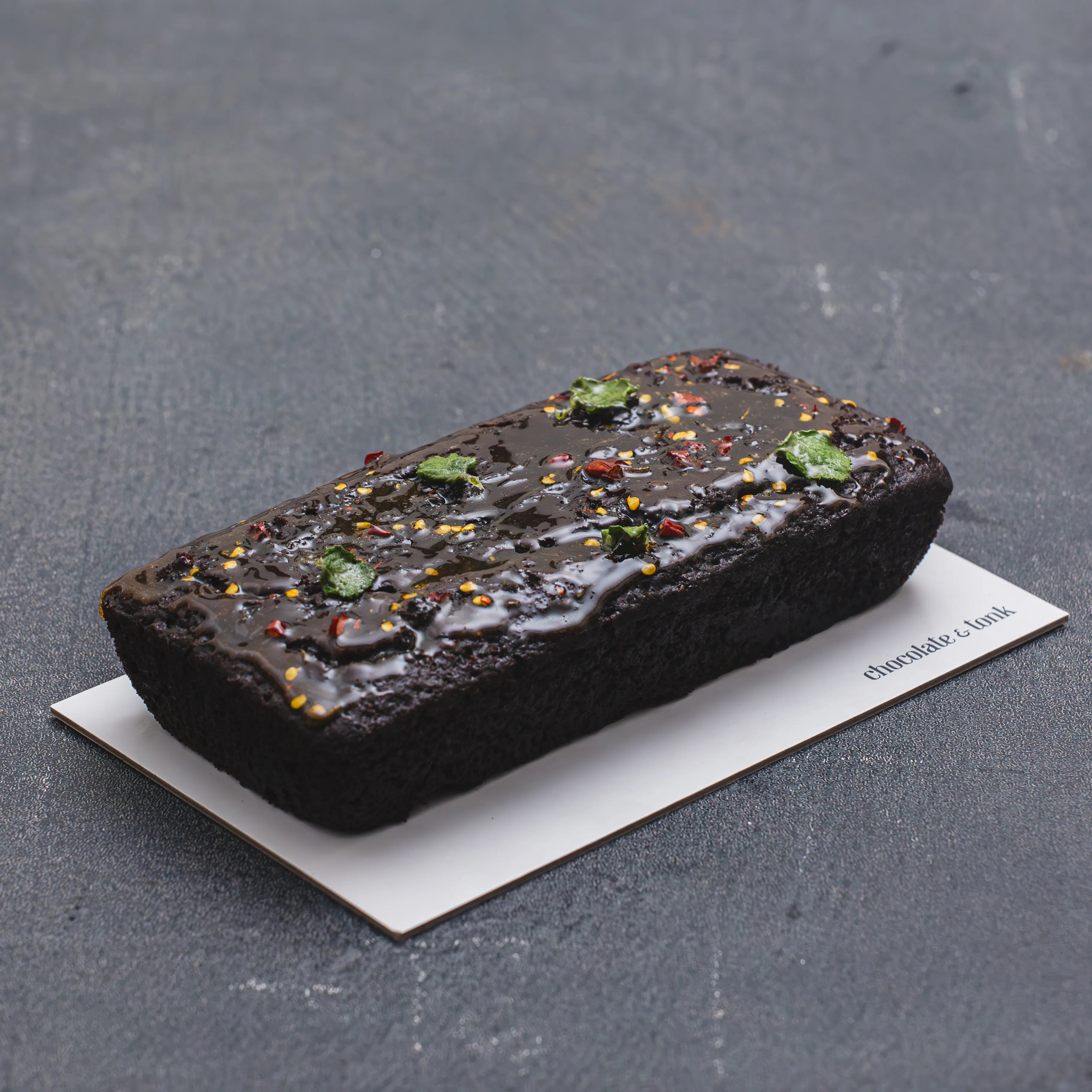 Chocolate loaf cake glazed with hot honey and spurflower