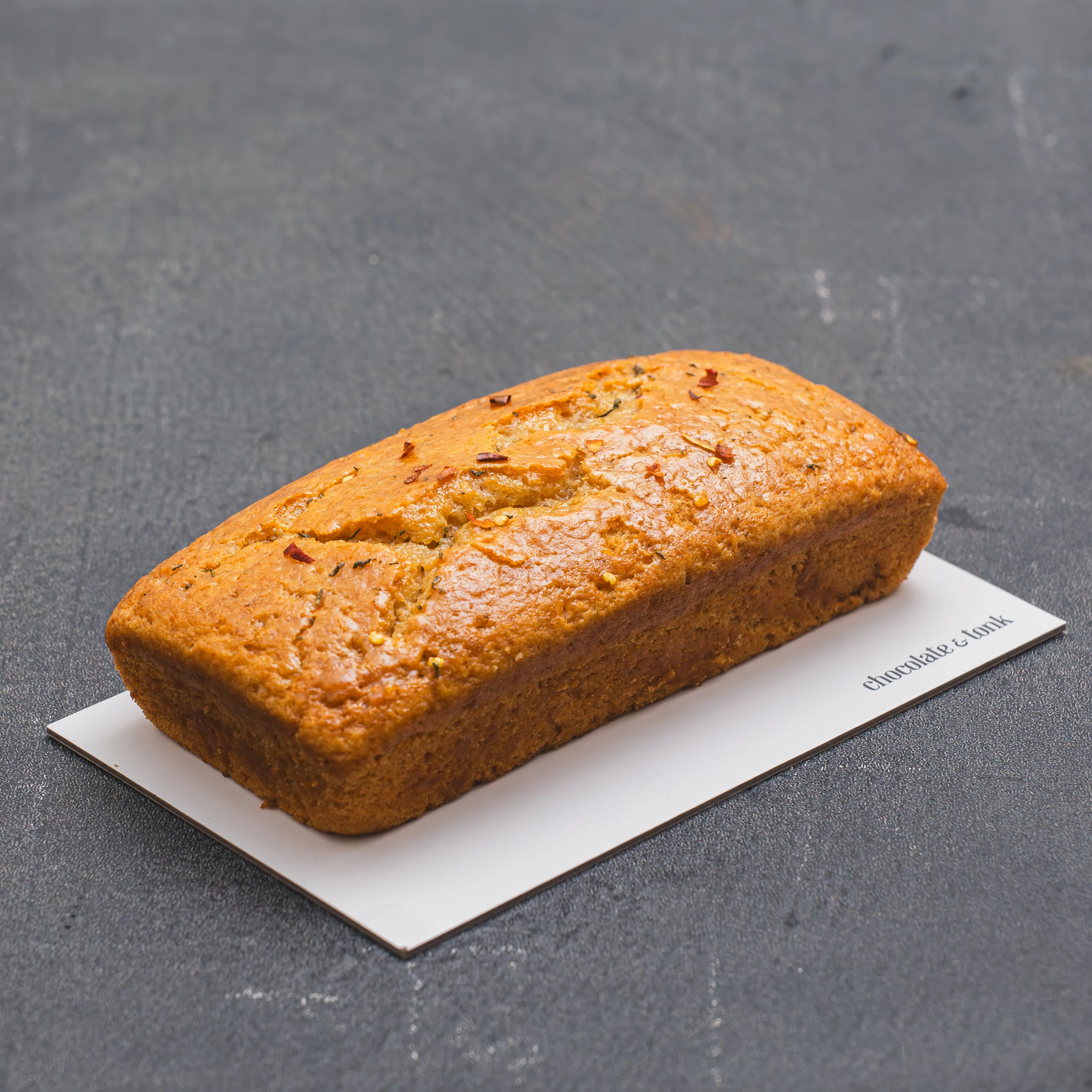 Vanilla loaf cake glazed with hot honey and spurflower